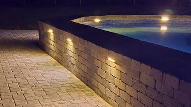 Retaining wall with lighting next to pool, Polk County FL